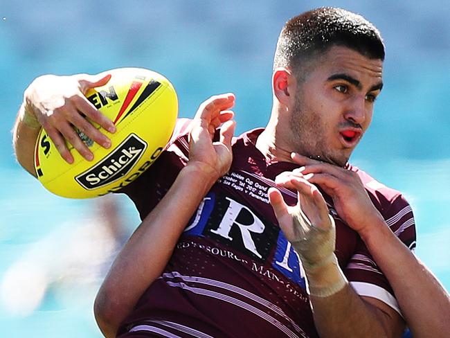 Manly's Tom Wright is tackled by Parramtta's Dylan Brown during the Parramatta Eels v Manly 2017 Holden Cup U20's Grand Final at ANZ Stadium, Sydney. Picture: Brett Costello