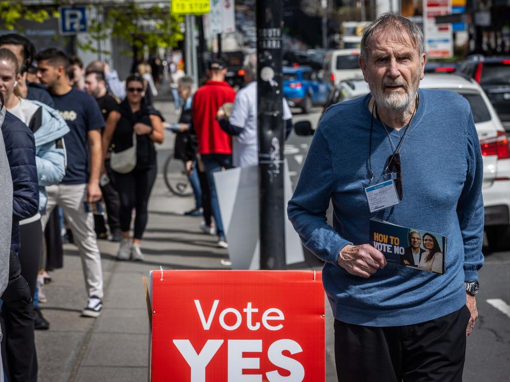 People prepare to vote at a polling station at the Prahran Library in Melbourne. Picture: Jake Nowakowski