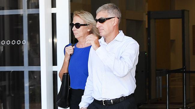 Former NT Police Assistant Commissioner Peter Bravos with wife Cindy Bravos outside the Supreme Court after pleading not guilty to two counts of rape. Picture: Katrina Bridgeford