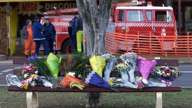 Palace Backpackers Hostel fire at Childers, Qld - flowers on park bench shrine opposite the hostel 24 Jun 2000.