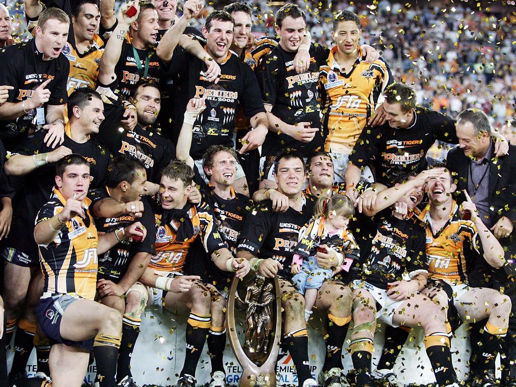 The Tigers celebrate after victory against the Cowboys in the 2005 Grand Final. Picture: AAP Image/Jenny Evans