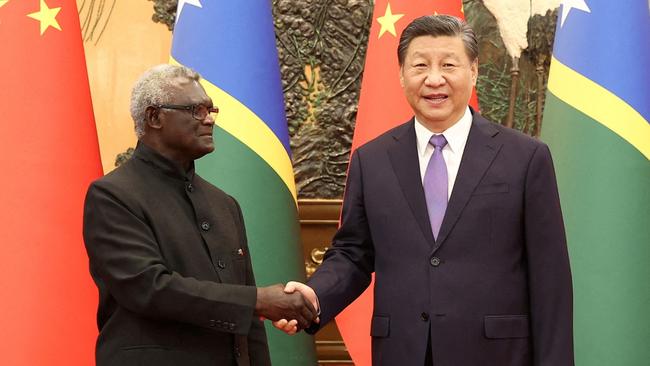 Solomon Islands’ former prime minister Manasseh Sogavare with Chinese President Xi Jinping in Beijing.