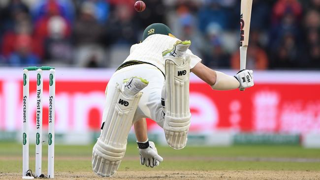 Travis Head is knocked off his feet by a ball from Ben Stokes. Picture: Getty Images