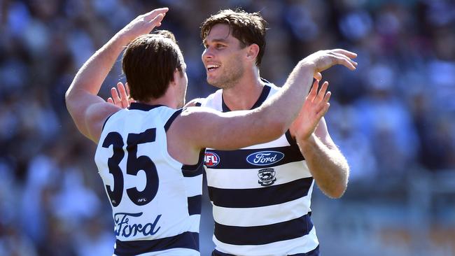 Patrick Dangerfield and Tom Hawkins celebrate a goal against the Suns. Picture: AAP