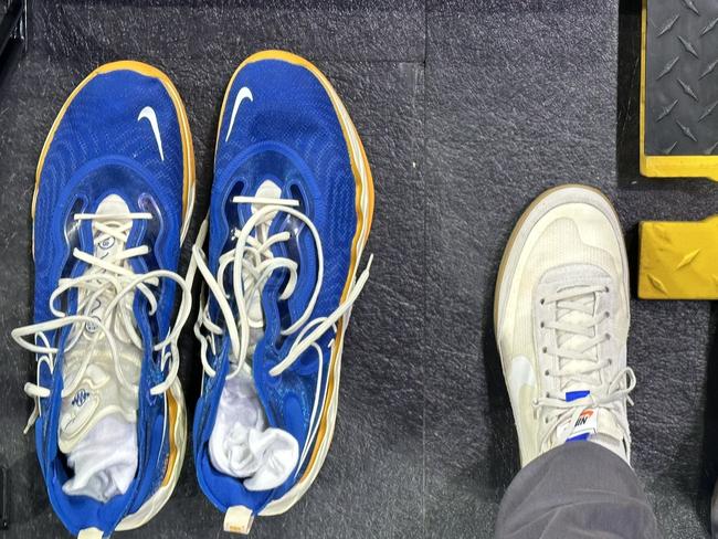 Victor Wembanyama's size 20.5 shoes compared to a regular person's size 13s