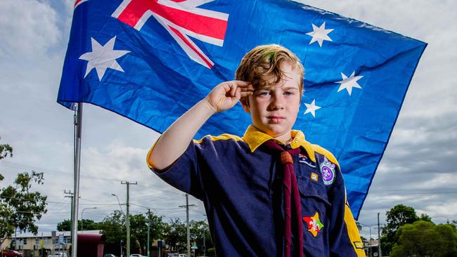 Eight-year-old Robert Kaden Marsden Scouts poses for a photograph outside his Logan Central house, He built a flagpole to commemorate ANZAC Day - Picture: Richard Walker