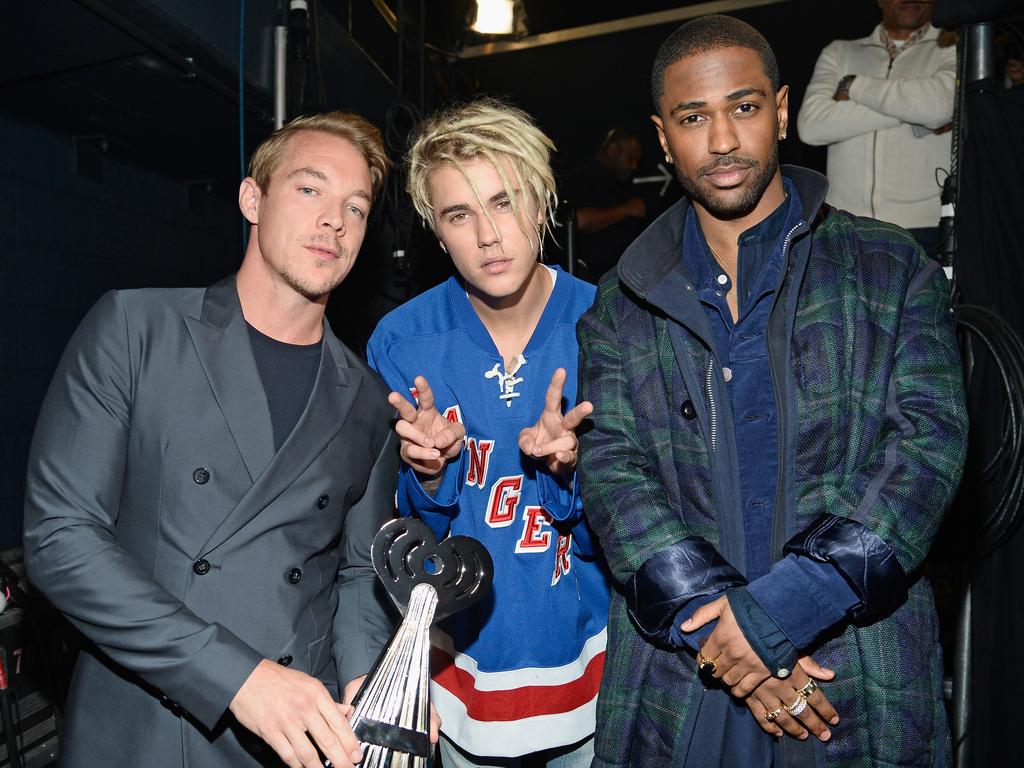 Diplo and Justin Beiber winners of the award for ‘Dance Song of the Year,’ for ‘Where are u now,’ with Big Sean backstage at the iHeartRadio Music Awards. Picture: Getty