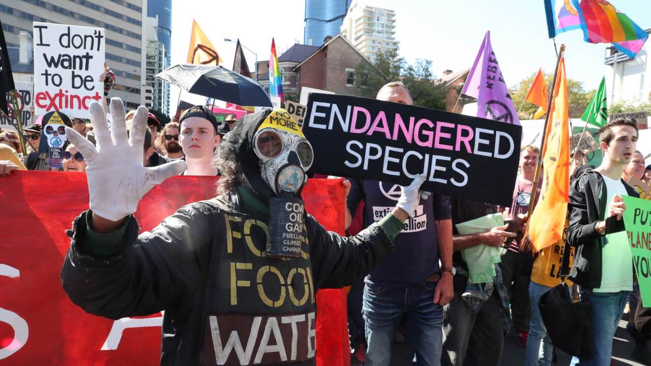 Police charge more than 70 Adani protesters in Brisbane