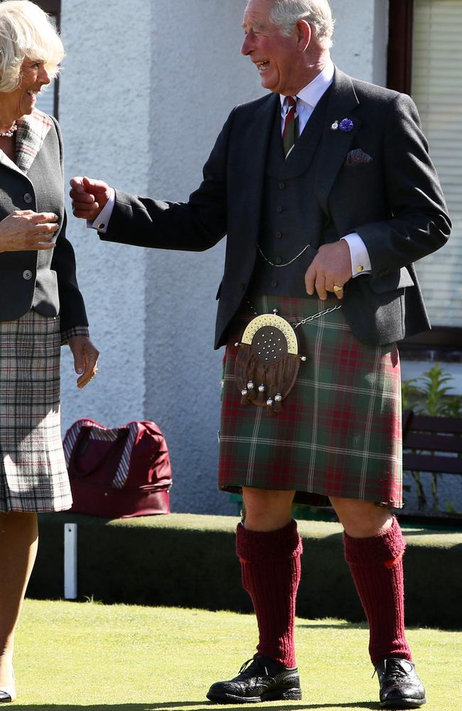 Charles and Camilla. They’re laughing because he normally wears his bright blue socks with this outfit. Picture: Getty