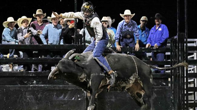 Travis Shaw competes in the Great Northern Bull riding series bull ride event at the Mossman Showgrounds. Picture: Stephen Harman