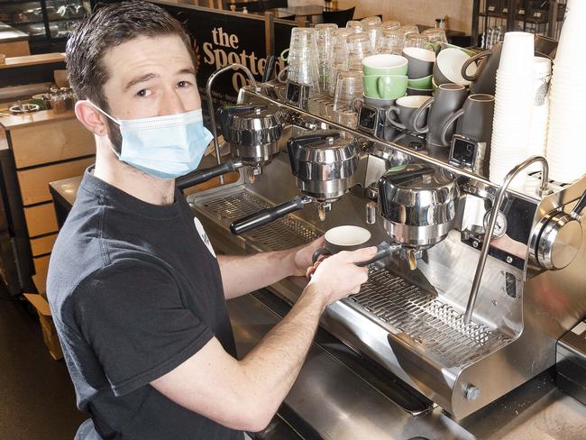 The Commonwealth government's cash handouts during the lockdown are only for workers who live/work in Greater Melbourne or declared hotspots. Cafe worker Luke Hannaford is eligible as he works at this Sunbury cafe, but just 20 minutes away in Gisborne there are workers who are not eligible.Picture:Rob Leeson.