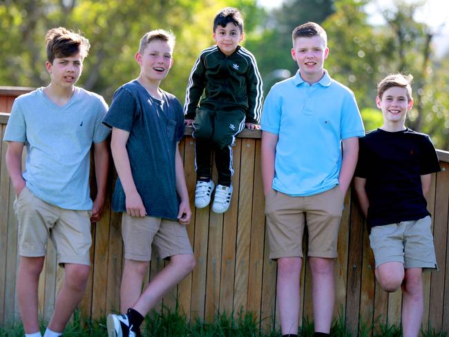 L-R Young heroes Ben Whitehouse 13, Zac Brown 13, Jaime Privett 13, Adam Al Kayal 4 and Pat Whitehouse 11 pose for photographs in Kings Langley. Kings Langley, Thursday, October 25th 2018. During the school holidays, four Kings Langley boys saved a Parramatta boy who was found unconscious at the bottom of a caravan park pool. (AAP Image / Angelo Velardo)