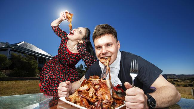 Kingaroy locals Heather Nicol (aka Scarlett Jigsaw) and Luke Tilney get their training in for the Bacon eating competition at this weekends Kingaroy Baconfest. Photo Lachie Millard