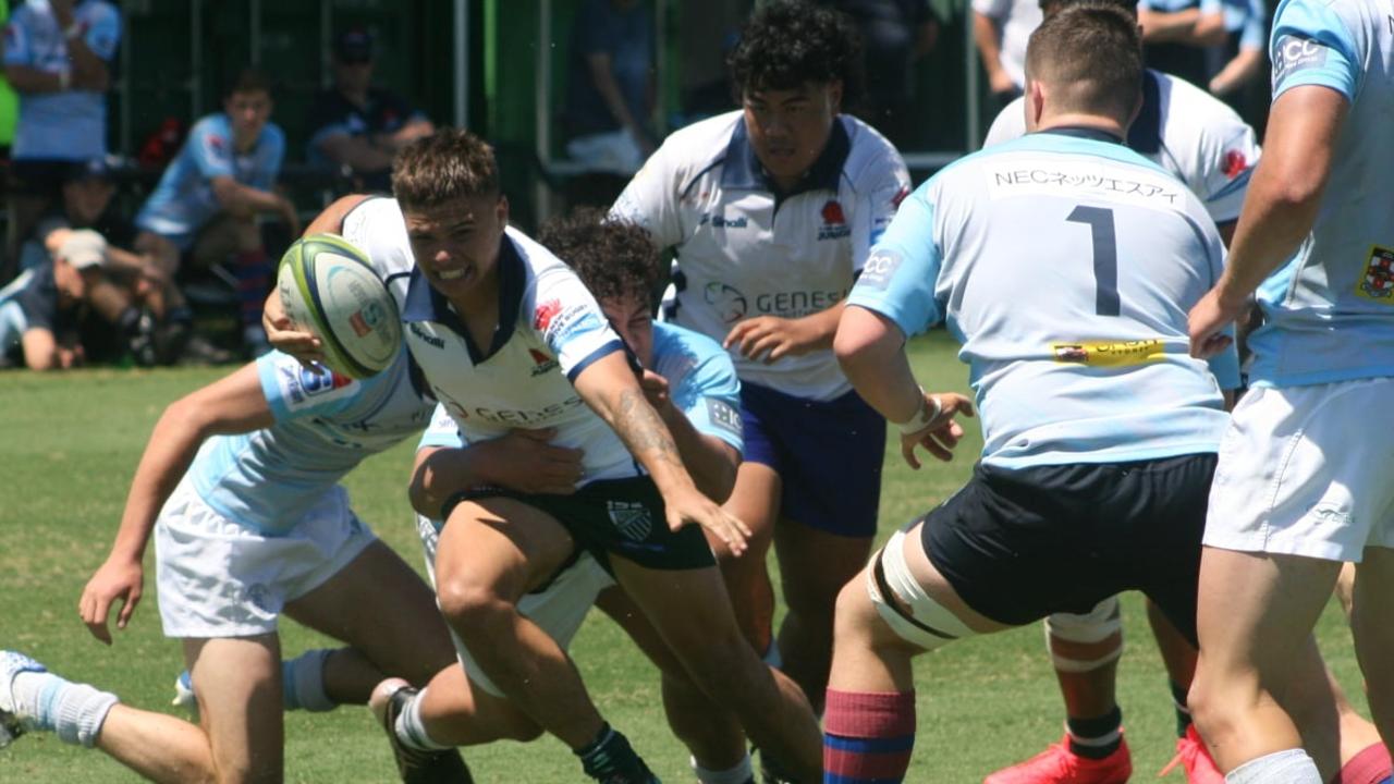 Young rugby player Gage Phillips on the run. Pic Supplied