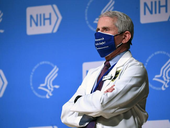 White House Chief Medical Adviser on Covid-19 Dr. Anthony Fauci listens to US President Joe Biden (out of frame) speak during a visit to the National Institutes of Health (NIH) in Bethesda, Maryland, February 11, 2021. (Photo by SAUL LOEB / AFP)