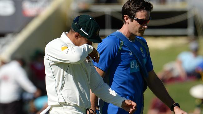 SPORT — Test Cricket. 2nd Test. Day 2. Australia v New Zealand at the WACA. Photo by Daniel Wilkins. PICTURED — Australian fielder Usman Khawaja leaves the field with a suspected hamstring injury