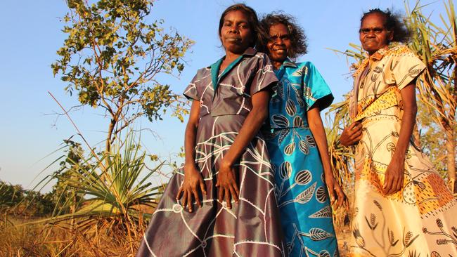 Babbarra Women’s Centre artists Jacinta Lami Lami and sisters Deborah Wurrkidj and Jennifer Wurrkidj, wearing Babbarra Designs x Raw Cloth Darwin, 2019. Photo: Ingrid Johanson.