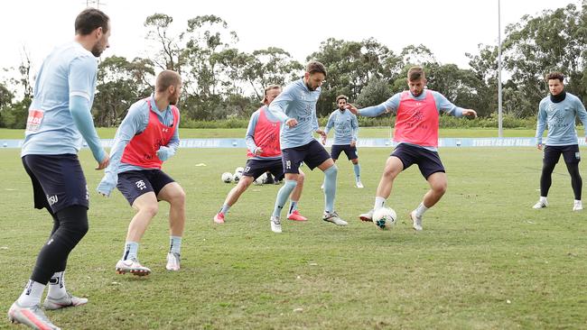 Sydney FC’s Milos Ninkovic and Chris Zuvela compete at a training session at Macquarie University on Thursday. Picture: Getty Images