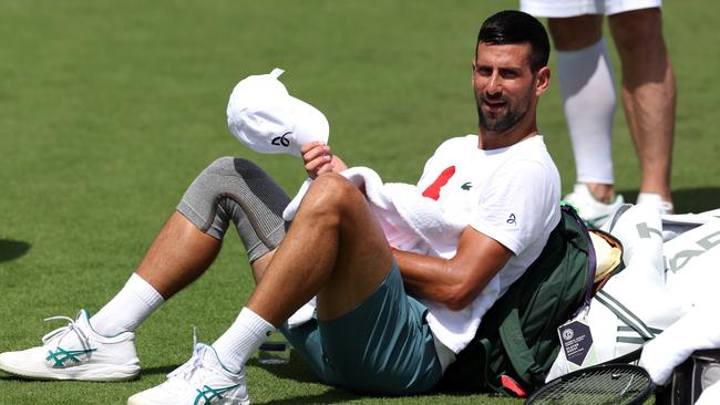 Novak Djokovic goes into Wimbledon with a knee injury. (Photo by Clive Brunskill/Getty Images)