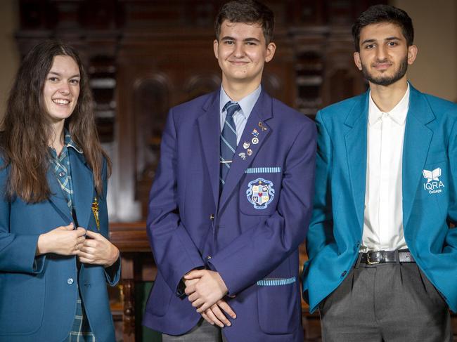 ADELAIDE, AUSTRALIA - Advertiser Photos FEBRUARY 25, 2022: South Australian Teen Parliament participants L to R India Ciura from St JosephÃs Port Lincoln, Adrien Niculescu from Sacred Heart College and Mobin Achakzai from IQRA College on the floor of the House of Assembly Chamber at Parliament House, SA. Picture Emma Brasier