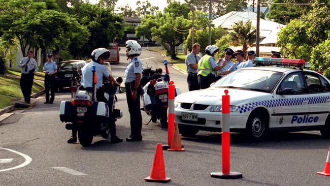 File pictures of police at 46 Morley St Toowong in 2022