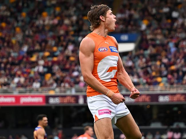 BRISBANE, AUSTRALIA - AUGUST 10: Aaron Cadman of the Giants celebrates kicking a goal during the round 22 AFL match between Brisbane Lions and Greater Western Sydney Giants at The Gabba, on August 10, 2024, in Brisbane, Australia. (Photo by Albert Perez/AFL Photos via Getty Images)