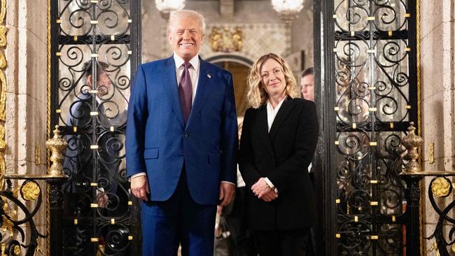 Italian Prime Minister Giorgia Meloni with Donald Trump at the entrance of his Mar-a-Lago resort in Florida on Saturday. Picture: AFP