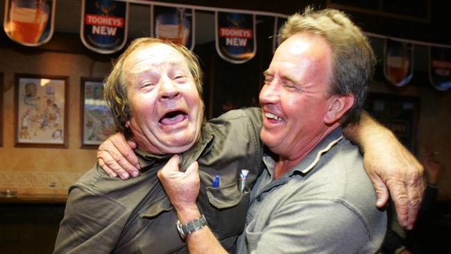 Tommy Raudonikis hams it up with his old footy foe and good mate Greg Oliphant.