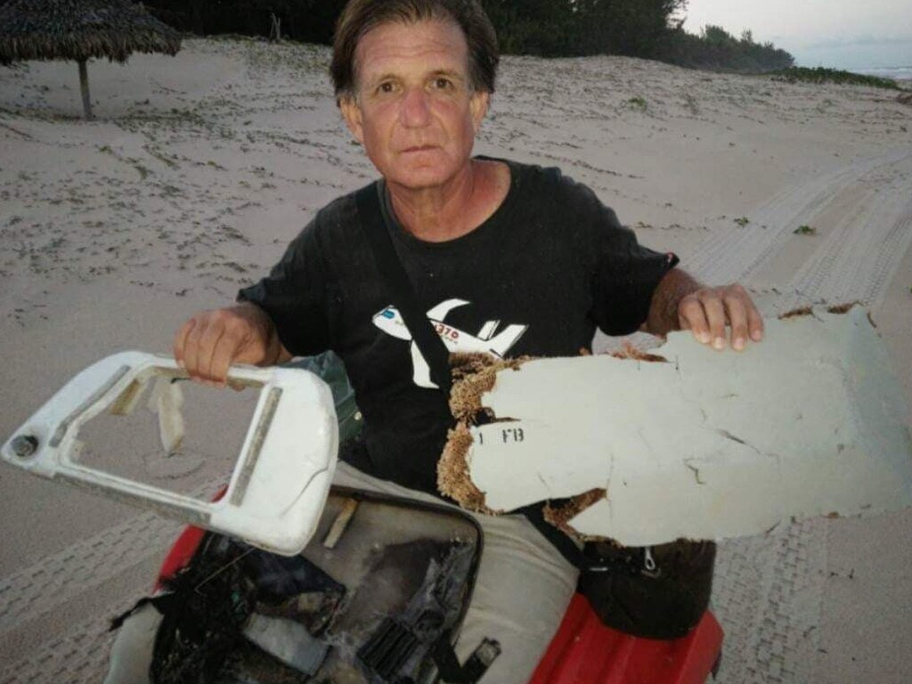 Plane wreck hunter Blaine Gibson with pieces of debris of the missing MH370. Picture: supplied