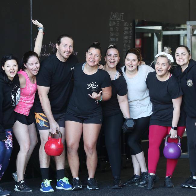 Ebony and her partner Mark Branigan with some of their Nana Blue clients. Picture: Sue Graham