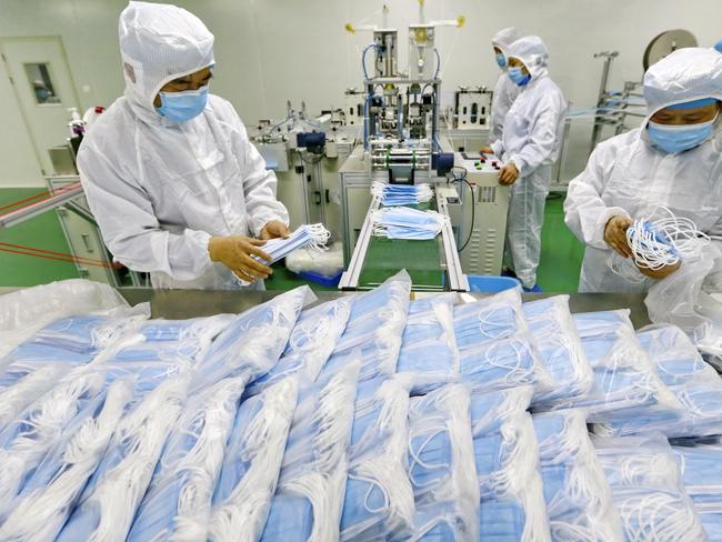 Workers in a Chinese factory that produces masks. Picture: AP