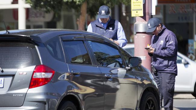 Monash Council parking inspectors dish out a fine on Kingsway, Glen Waverley.