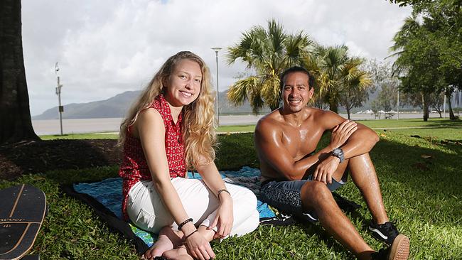 Roberta Vieira and Mareio Ambrozzi from Cairns North relaxing in the shade on the Esplanade in Cairns ahead of predicted showers and cloudy weather. PICTURE: STEWART McLEAN