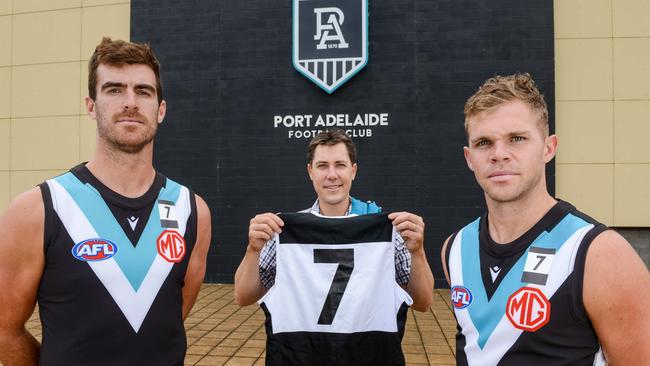 Ebert’s son, Ben, with current players Scott Lycett and Dan Houston.