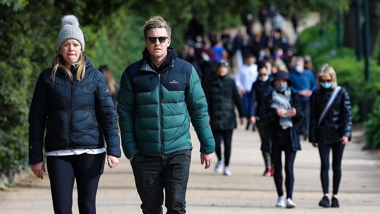 People exercise around the Tan in Melbourne during lockdown. Picture: NCA NewsWire / Ian Currie