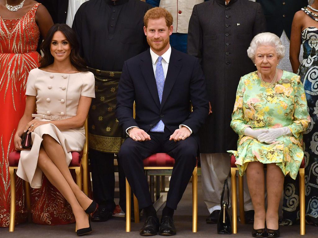 June 26, 2018: (L-R) Meghan, Duchess of Sussex, Britain's Prince Harry, Duke of Sussex and Britain's Queen Elizabeth II pose for a picture during the Queen's Young Leaders Awards Ceremony. Picture: John Stillwell