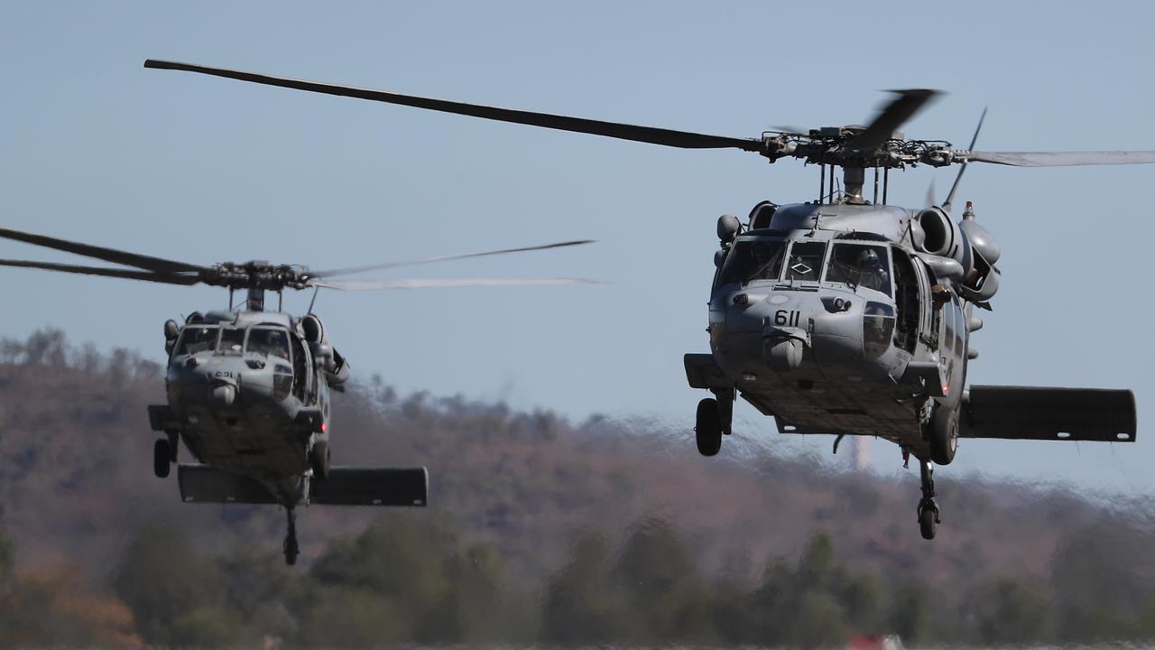 Two American choppers prepare to take off from Rockhampton airport. Australian and American troops on the ground at Camp Rockhampton.  Pic Peter Wallis