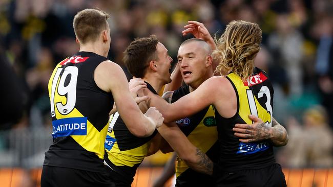 MELBOURNE, AUSTRALIA - JUNE 15: Dustin Martin of the Tigers celebrates a goal with teammates during the 2024 AFL Round 14 match between the Richmond Tigers and the Hawthorn Hawks at The Melbourne Cricket Ground on June 15, 2024 in Melbourne, Australia. (Photo by Michael Willson/AFL Photos via Getty Images)