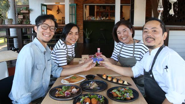 Yuki Kanazawa and wife Lilian Chang, with Yuka Otani and her husband Fumiyoshi Iwasaki, toasting their hard work. Picture Glenn Hampson