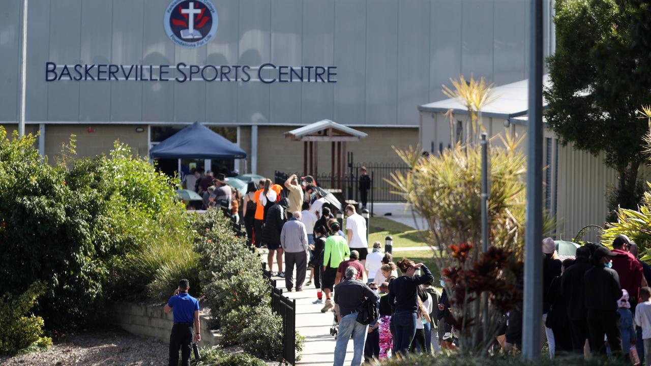 Locals lining up for COVID-19 testing at Parklands Christian College in Park Ridge. Picture: Tara Croser.