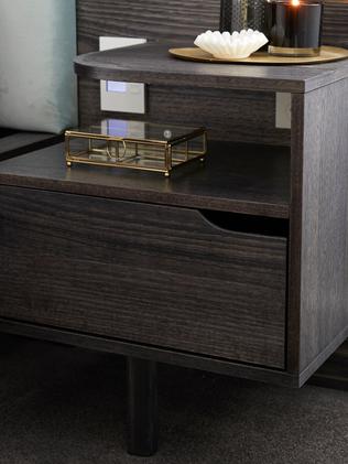 The bedside table matched the other cabinetry.