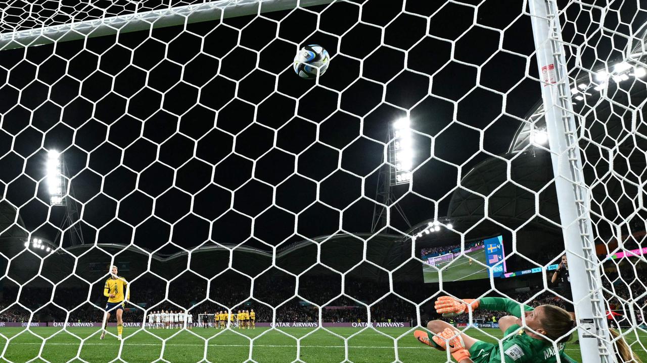 Naeher watches the ball loop towards goal, having initially saved it. She then swatted it away, but it had crossed the line my a millimetre. Picture: William West/AFP