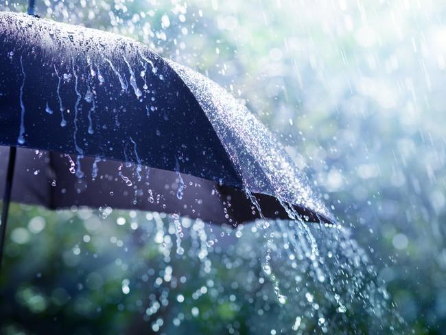 Rain On Umbrella - Weather Concept. Photo: iStock, Romolo Tavani.