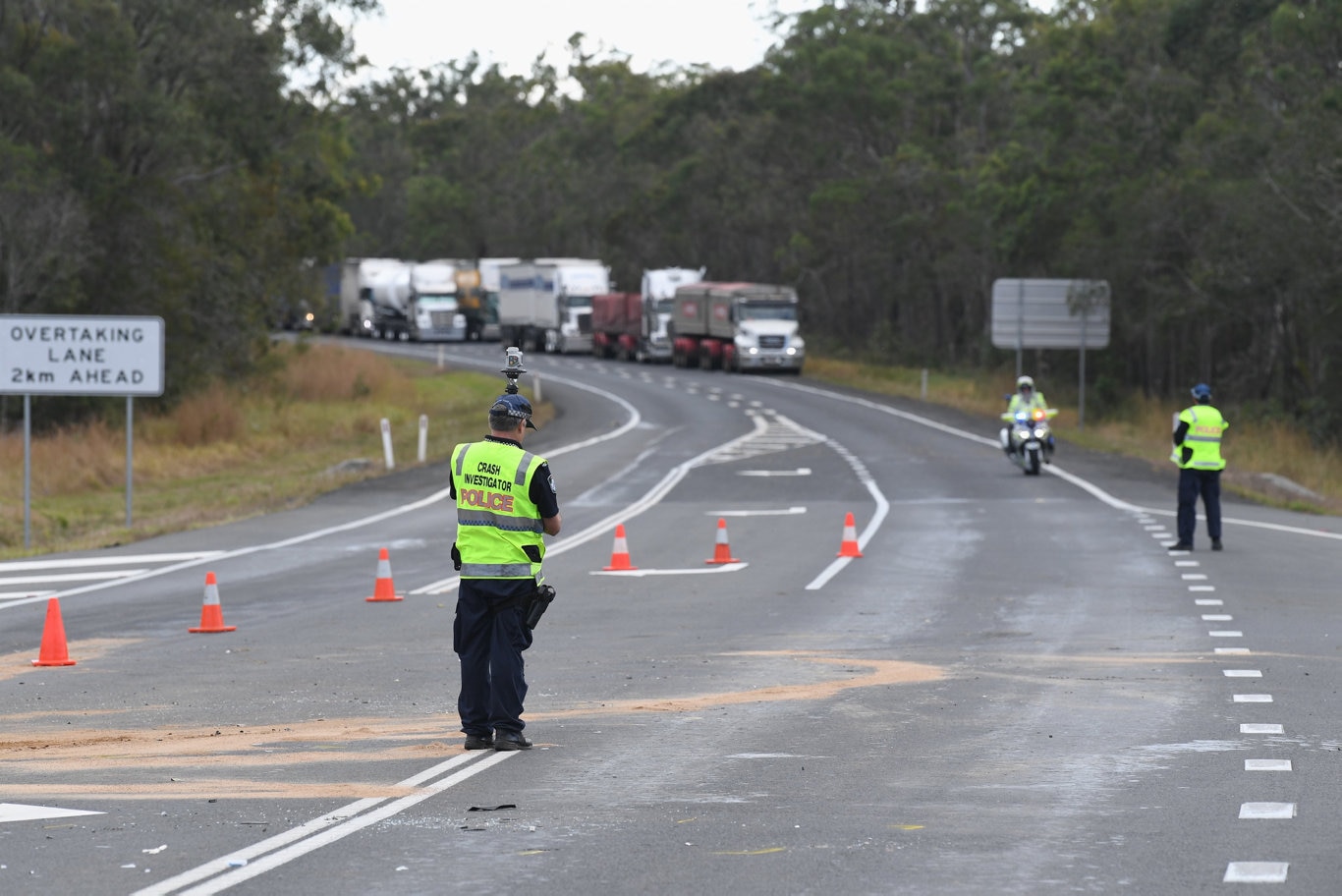 Two vehicle crash at the intersection of Thomas St, Howard and the Bruce Highway. Crash investigators at the scene.