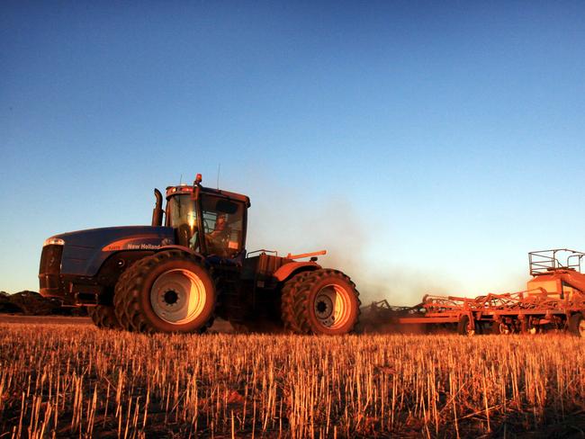 The Schaefer family at their family farm near Kimba on Eyre Peninsula. Various pics at Seeding time. Farmer driving tractor pulling machinery in paddock.