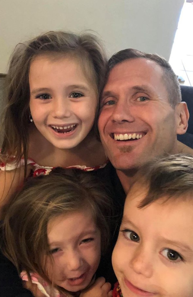 Rowan Baxter with his children. All four were killed in a car fire at Camp Hill. Photo: Facebook