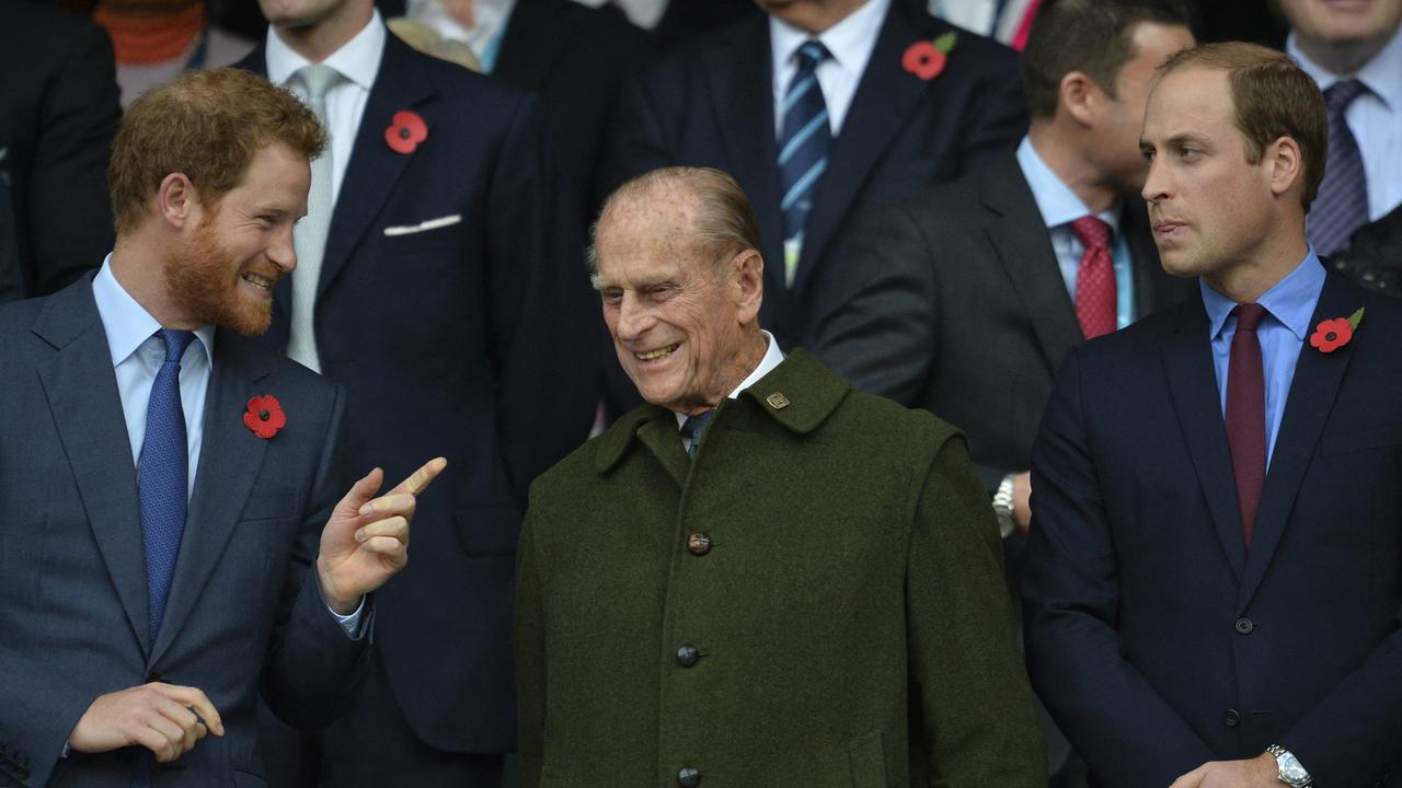 Harry and William with their grandfather watching the final match of the 2015 Rugby World Cup between New Zealand and Australia at Twickenham. Picture: Glyn Kirk/AFP