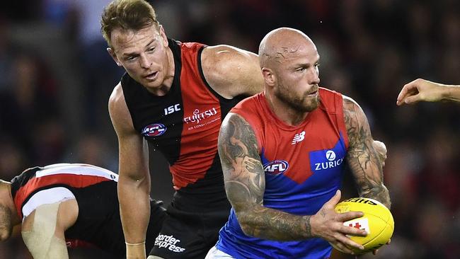 Nathan Jones slips away from Brendon Goddard.