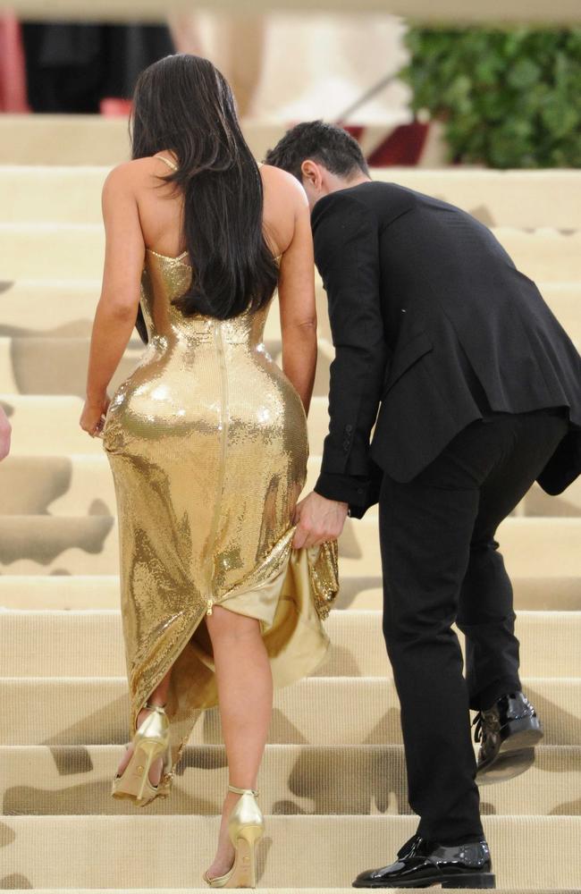 Kim Kardashian, pictured in Versace at the Met Gala in New York this week, has never admitted to a bum enhancement. Picture: MEGA