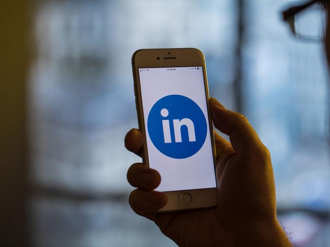 The logo for Linkedin Corp., a unit of Microsoft Corp., sits on an Apple iPhone smartphone in this arranged photograph in London, U.K., on Monday, Aug. 20, 2018. The NYSE FANG+ Index is an equal-dollar weighted index designed to represent a segment of the technology and consumer discretionary sectors consisting of highly-traded growth stocks of technology and tech-enabled companies. Photographer: Jason Alden/Bloomberg